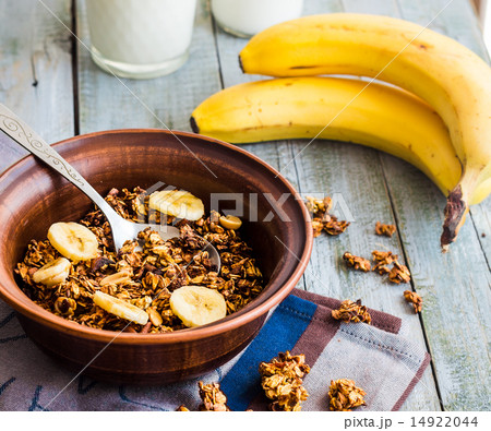 homemade granola with bananas, nuts and dates,milk 14922044