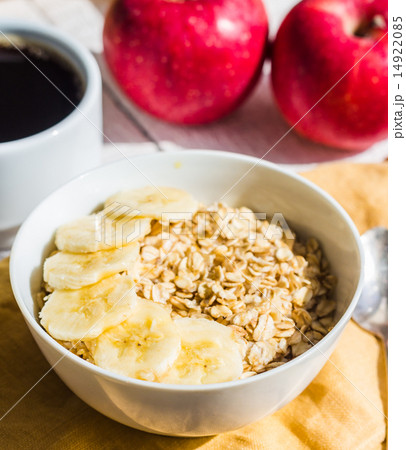 oatmeal with bananas, apples and a cup of coffee oatmeal with bananas, apples and a cup of coffee 14922085