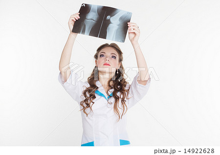 Beautiful intern girl with the x-ray picture of knee Beautiful intern girl with the x-ray picture of knee 14922628