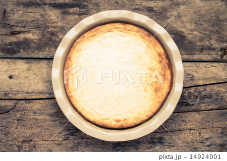 Fresh baked cheesecake on wooden table. Fresh baked cheesecake on wooden table. 14924001