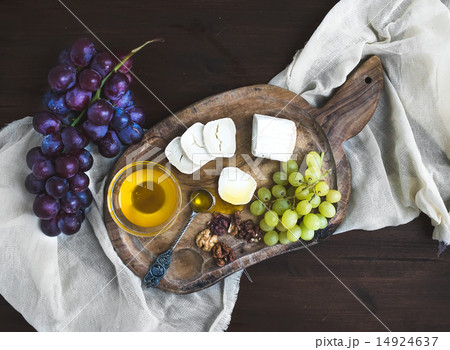 Goat brie cheese with fresh greapes and honey 14924637