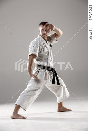 Man in white kimono training karate 14936081