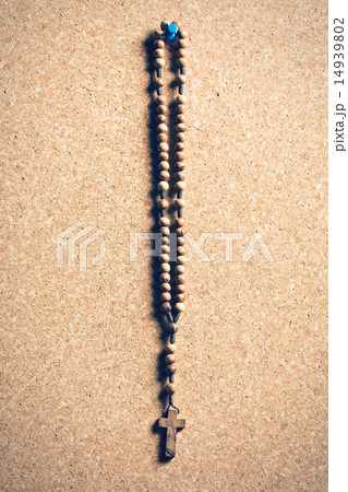 rosary beads on cork board 14939802