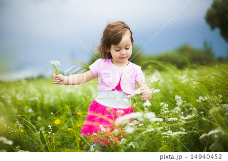 beautiful carefree girl playing outdoors in field beautiful carefree girl playing outdoors in field 14940452