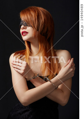 Portrait of red-haired submissive in handcuffs Portrait of red-haired submissive in handcuffs 14940489