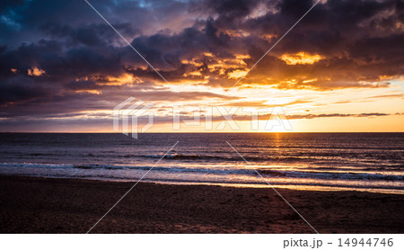 Bright sunset at the sea 14944746