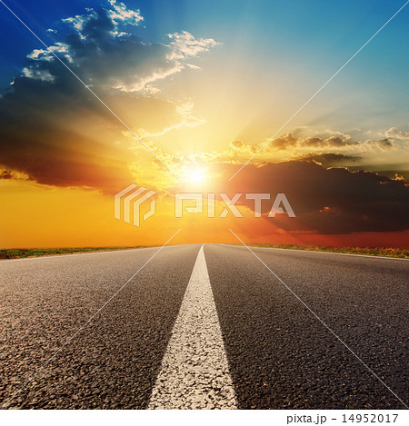 asphalt road under sunset with clouds 14952017