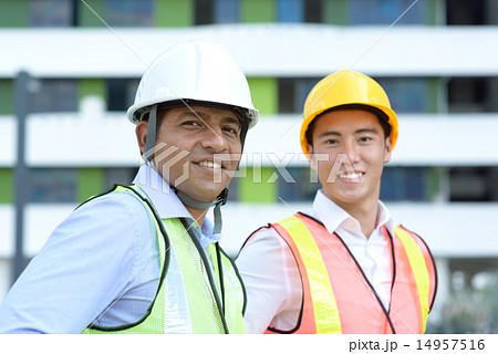 Maintenance team in front of industrial building Maintenance team in front of industrial building 14957516