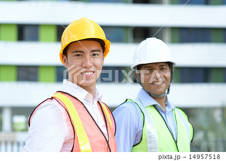 Maintenance team in front of industrial building Maintenance team in front of industrial building 14957518