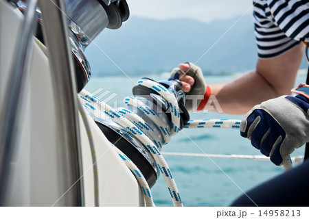 Winch and sailors hands on a sailboat 14958213
