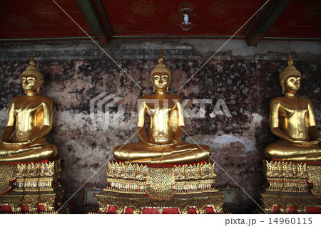Golden Buddha statues at corridor in Wat Suthat Golden Buddha statues at corridor in Wat Suthat 14960115