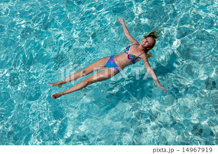 Young woman smiles, swiming in ocean, Maldives Young woman smiles, swiming in ocean, Maldives 14967919