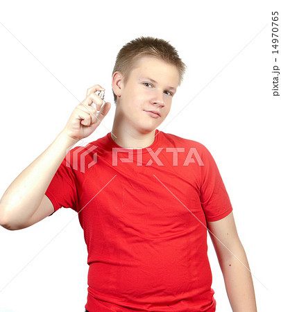 boy, the teenager spraying fragrance perfume.. 14970765