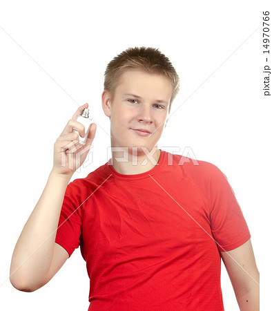 boy, the teenager spraying fragrance perfume.. 14970766