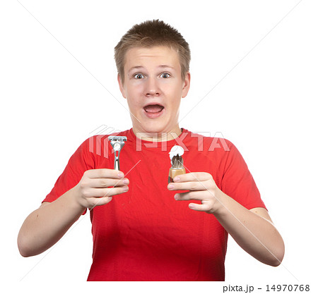 teenager the first time tries to have a shave and  14970768