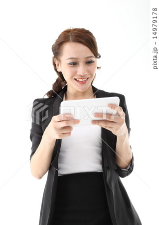Woman looking reading in tablet pc 14979178