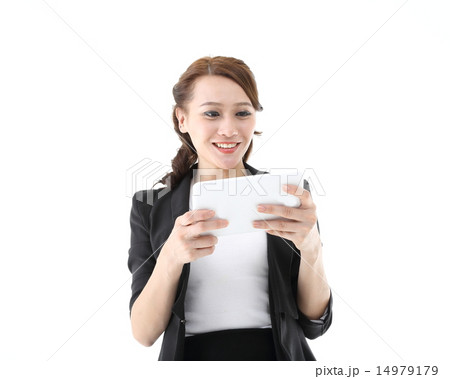 Woman looking reading in tablet pc Woman looking reading in tablet pc 14979179