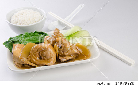 Chicken with rice and vegetables in background 14979839