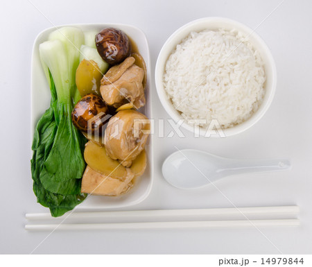 Chicken with rice and vegetables in background 14979844