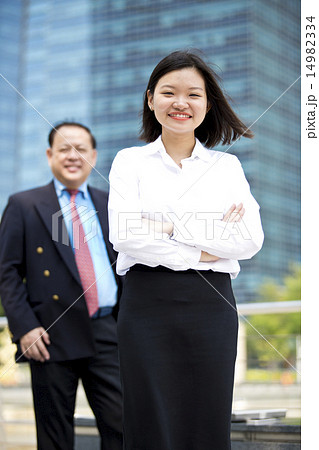 Asian businessman & young female executive 14982334