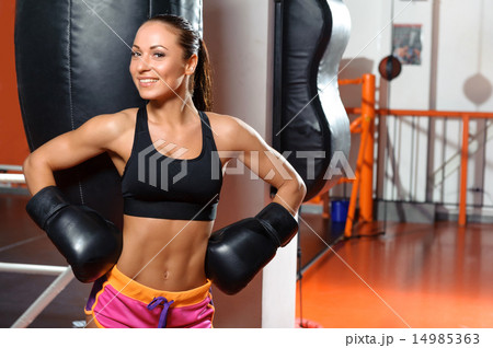 Female boxer with punching bag 14985363