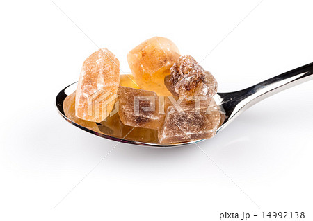 brown caramelized sugar in a wooden spoon 14992138