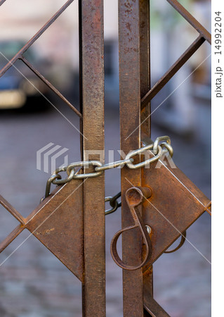 Old metal lock on chain Old metal lock on chain 14992204