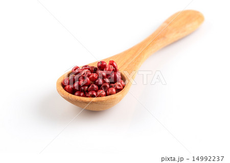 red peppercorns in wooden spoon isolated red peppercorns in wooden spoon isolated 14992237
