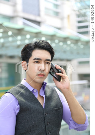 Man talk on cellphone Man talk on cellphone 14992654