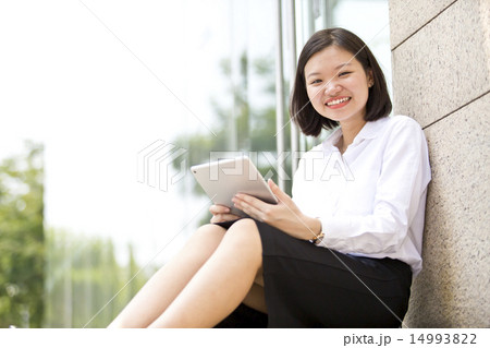 Asian young female executive holding a tablet Asian young female executive holding a tablet 14993822