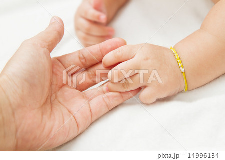 baby hand holding mother hand together baby hand holding mother hand together 14996134