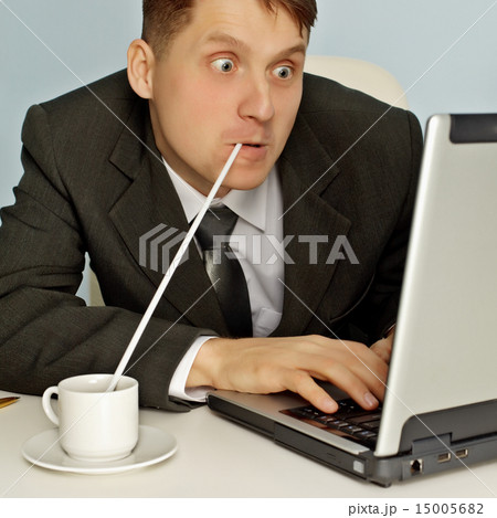 Funny businessman drinking coffee and working 15005682