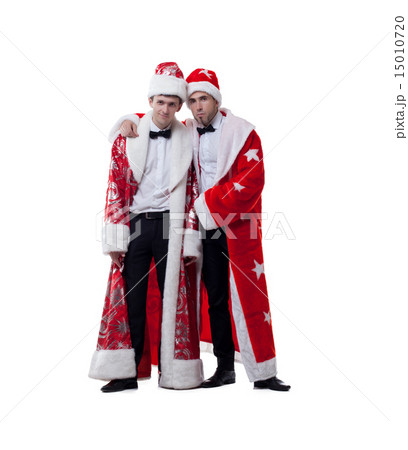 Funny friends posing in coats of Santa Claus Funny friends posing in coats of Santa Claus 15010720