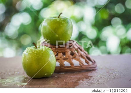 green apple on the table outside the home. 15012202