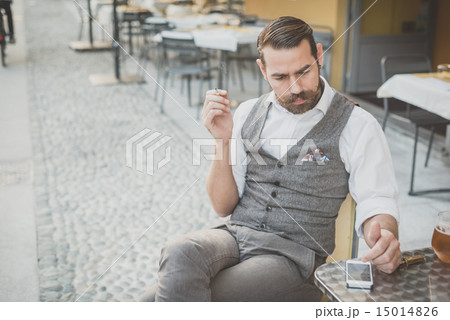 handsome big moustache hipster man using smart phone 15014826