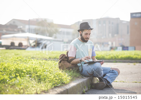 young handsome hipster gay modern man using tablet 15015545