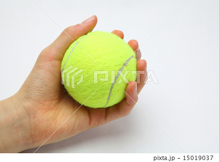 テニスボールと手の写真素材