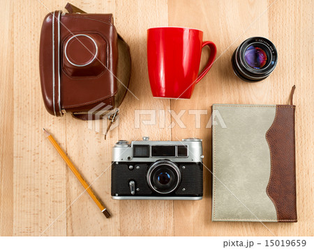 retro workspace with camera, lens, notebook,pencil retro workspace with camera, lens, notebook,pencil 15019659