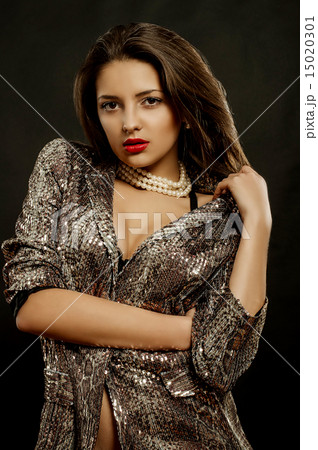 Girl with  dark hair and beautiful jewelry 15020301