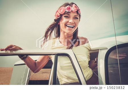 Hippie girl in a van on a road trip 15023832