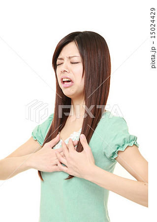 心臓発作を起こす女性の写真素材