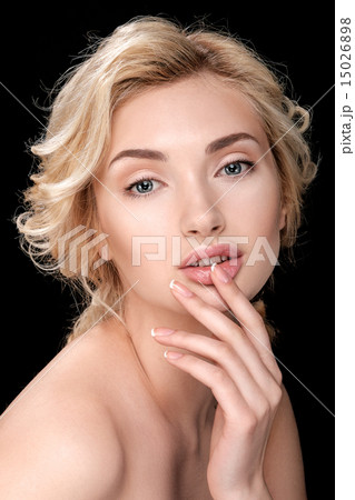 Beautiful blonde woman with clean skin. Finger touches lips. Beautiful blonde woman with clean skin. Finger touches lips. 15026898