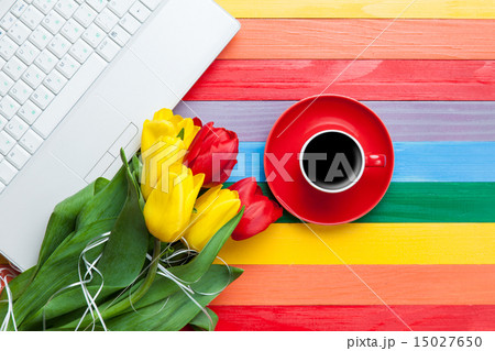 Cup of coffee with tulips and notebook 15027650