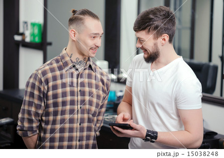 Barber talks to a client Barber talks to a client 15038248