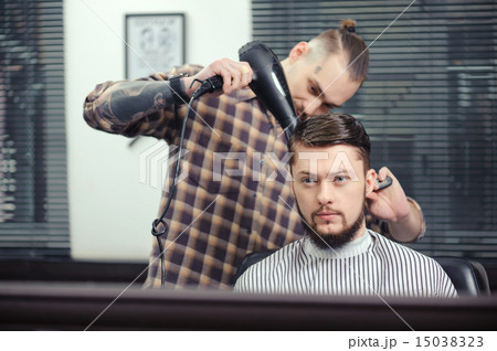 Barber makes a haircut Barber makes a haircut 15038323