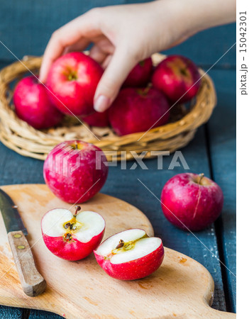 cut in half fresh red apples on a wooden, fruits cut in half fresh red apples on a wooden, fruits 15042301