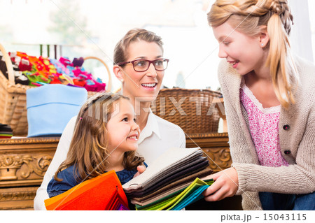 Family buying supplies in handicraft store Family buying supplies in handicraft store 15043115