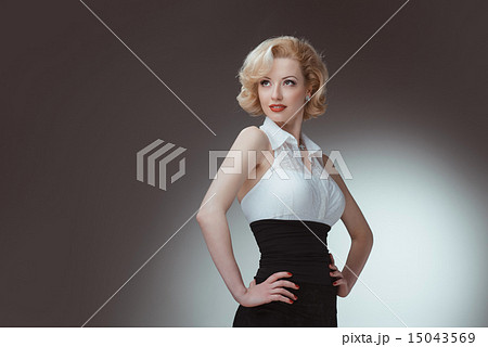 Pin-up girl young and beautiful woman portrait on gray background 15043569