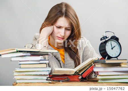 girl student with glasses reading books girl student with glasses reading books 15047762