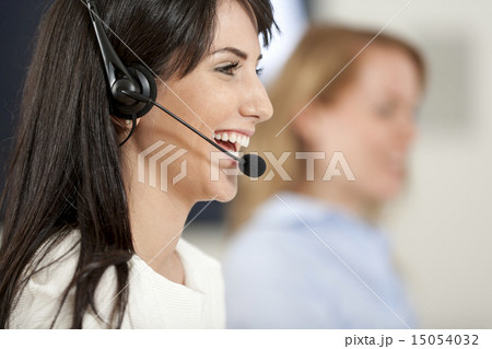 Women in a busy call centre Women in a busy call centre 15054032